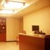 Binhai Mingzhu Hotel Beijing lobby with reception desk, seating area, and ceiling lights