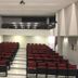 Hotel Verona Tower in Divinópolis auditorium with red seats and central aisle