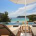 Meliá Cala Galdana terrace with loungers overlooking a turquoise bay in Cala Galdana
