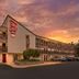 Red Roof Inn Tinton Falls-Jersey Shore exterior at sunset in Tinton Falls with parking lot and balconies