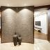 Amanti Hotel Seoul Hongdae room with curved textured wall, decorative vases, and visible bedroom area