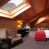HG Alto Aragón in Formigal attic hotel room with skylight, double bed, desk and chair