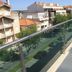 Casas e Quintas de Praia in Aveiro, balcony overlooking a tree-lined street and apartment buildings