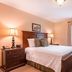 Brick Street Inn in Zionsville guest room with king bed, nightstands, window, and armoire