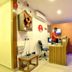 Hotel Golden Inn Chandigarh reception desk with staff member and wall-mounted TV in a compact lobby
