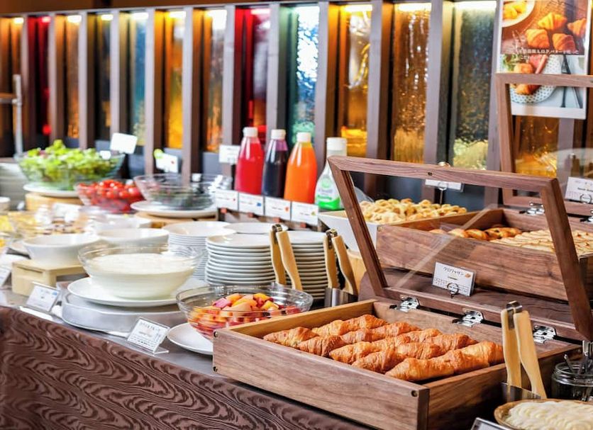 Breakfast buffet at Hotel Torifito Otaru Canal in Otaru with croissants, salads and drinks