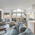 Antlers at Vail living area with mountain views, fireplace, seating, and kitchen island