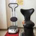 Central Hotel Fukuoka: compact massage chair and luggage scale in a hotel hallway, Fukuoka