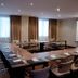 Concorde Paris Tunis meeting room with U-shaped conference tables and projector screen