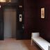 Rkn Hotel Pondicherry lobby with elevator and seating bench