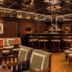 Hôtel Des Grands Voyageurs bar lounge in Paris with mirrored ceiling and seating