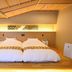 Matsubaya Ryokan in Kyoto twin beds on tatami platform with warm lighting and low Japanese-style ceiling