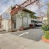 The Tides Laguna Beach entrance with driveway, palm landscaping, and oceanfront-style coastal exterior