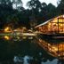 Rodavento Valle de Bravo lakeside glass pavilion reflected in calm water at dusk