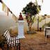 Stupa Resort in Nagarkot outdoor terrace with prayer flags, bench, table and chairs overlooking hills