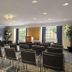 Microtel Inn & Suites by Wyndham Ponchatoula/Hammond meeting room with rows of chairs and podium