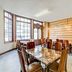 Belvilla Ilford Station Hotel in Ilford meeting room with marble table and wooden chairs