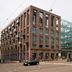 Amadi Park Hotel Amsterdam exterior with modern glass atrium and street view