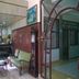 Hilltown Hotel in Madikeri reception area with seating and glass entry archway