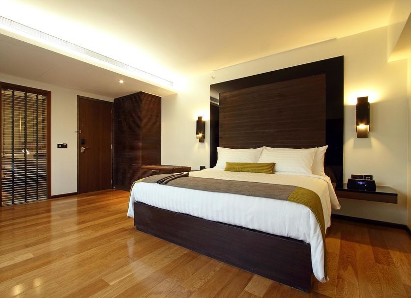 Svenska Design Hotel Mumbai guest room with king bed and polished wood floors