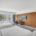The Garden Hotel & Resort Fort Lauderdale guest room with two beds and a balcony view