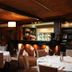 The Barn Accommodation in Mount Gambier restaurant with white tablecloths and a bar