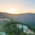 Hotel Woodrina in Shimla on a forested hillside with mountain valley views at sunrise