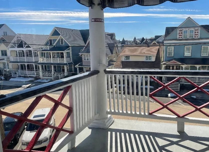 Quaker Inn in Ocean Grove balcony view with porch railing and neighboring seaside houses