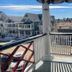 Quaker Inn in Ocean Grove balcony view with porch railing and neighboring seaside houses