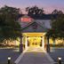 Hilton Garden Inn Montgomery East entrance at dusk with lit walkway and trees