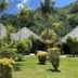 Hotel Le Mahana in Huahine with thatched bungalows and lush tropical garden