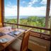 Termas Puyehue Wellness & Spa Resort dining area with panoramic mountain and lake views in Puyehue