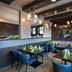 Michel Hotel Waldkirchen am Badepark restaurant with blue chairs and tables in Waldkirchen