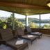 Le Manoir Au Lac in Gérardmer: covered terrace with loungers and lake views
