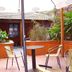 Hotel Beltran in Colonia del Sacramento patio with tables, chairs and potted plants