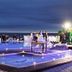 Hotel Morro dos Conventos rooftop pool at night overlooking the ocean in Araranguá