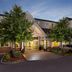 Residence Inn by Marriott Dayton Vandalia exterior entrance at dusk in Dayton, with trees and parked cars