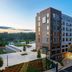 AC Hotels by Marriott Tallahassee Universities at the Capitol exterior with pool and evening entrance in Tallahassee