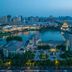 New Century Grand Hotel Kaifeng with panoramic lake and city skyline views at dusk