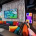 Aloft Waco Downtown lobby with colorful seating, pool view, and floor-to-ceiling windows in Waco