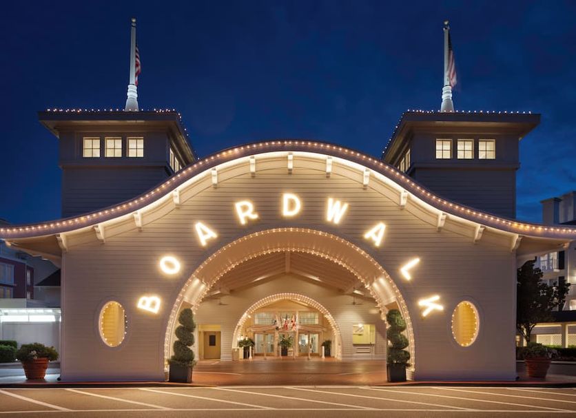 Disney's Boardwalk Inn entrance in Lake Buena Vista, with lit archway at night