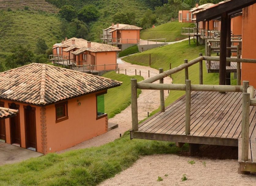 Pousada Villa Dos Leais in Serra Negra with hillside cottages and wooden balcony deck