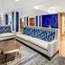Holiday Inn Express & Suites Colorado Springs-First & Main lobby seating area with sofas and coffee tables
