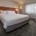 Guest room at Courtyard by Marriott Fairfax Fair Oaks in Fairfax with king bed and window seating