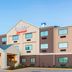 Fairfield Inn & Suites by Marriott Galesburg exterior with covered entrance and blue sky