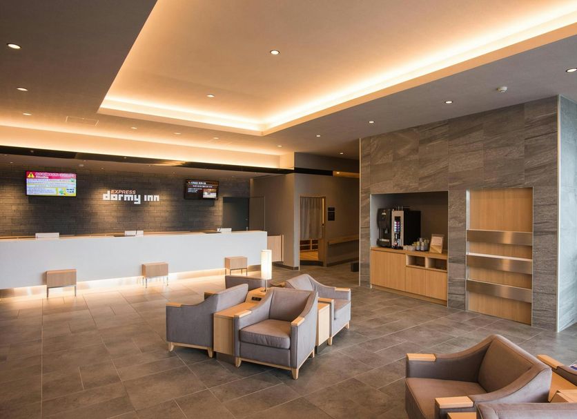 Dormy Inn Express Sendai Seaside lobby with reception desk and lounge seating in Sendai