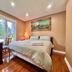 Cozy Home Near Transit & Hillcrest Mall in Richmond Hill bedroom with king bed, desk and garden view