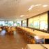 Alpina Löwen Hotel in Sankt Märgen dining room with tables, chairs, and large windows