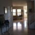 Happy Valley House Phoenix interior hallway with stairs, seating area and natural light