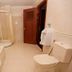 Majestic Oriental Hotel Siem Reap bathroom with bathtub, shower, toilet and urinal